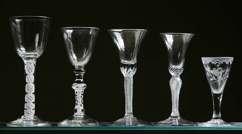 Lot image - Group of Five George II and George III Glass Goblets   Circa 1750-70 Four with airtwist stems and one with etched de...