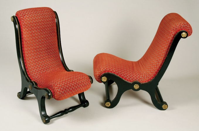 Lot image - Pair of Victorian Gilt-Metal Mounted Ebonized Slipper Chairs