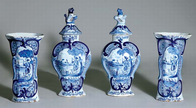 Lot image - Pair of Dutch Delft Covered Vases and Beakers  de Grieksche Factory, 18th century Each domed cover with a dog finial, abov...
