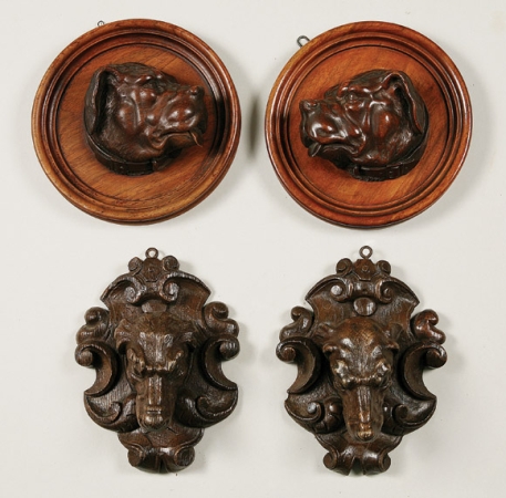 Lot image - Pair of Carved Walnut Dog Profiles; Together with a Pair of Carved Oak Dog Plaques