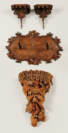 Lot image - Austrian Carved Fruitwood and Antler Hat Rack; Together with a Leather Decorated Foliate Bracket and Pair of Stained Wood Brackets