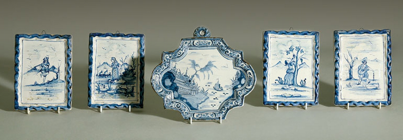 Lot image - Group of Four Dutch Delft Plaques; Together with a Cartouche-Shaped Plaque