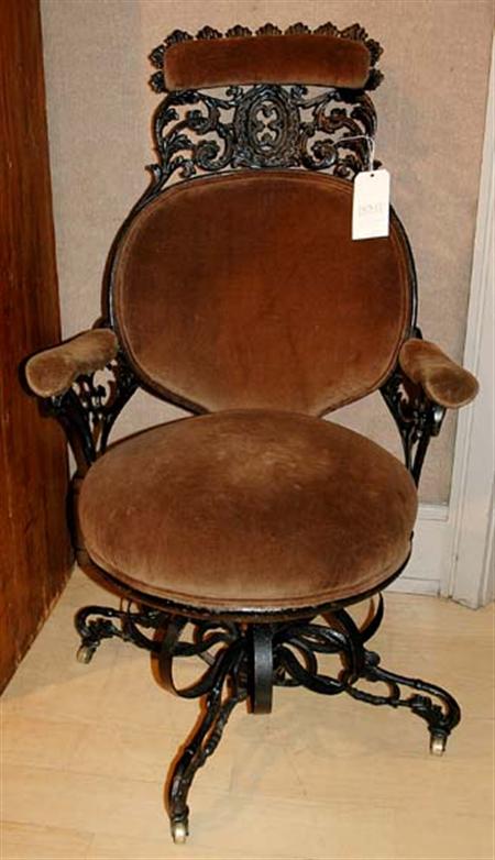 Lot image - American Painted and Upholstered Cast Iron Centripetal Rocking Armchair