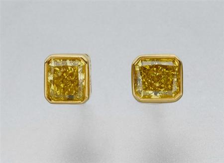 Lot image - Pair of Treated Yellow Diamond Stud Earrings