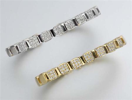 Lot image - Pair of Two-Color Gold and Diamond Bangles