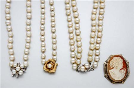 Lot image - Three Cultured Pearl Necklaces and a Shell Cameo Pendant Brooch