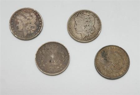 Lot image - Four U.S. Silver Dollars
