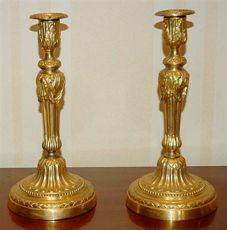 Lot image - Pair of Louis XVI Gilt-Bronze Candlesticks