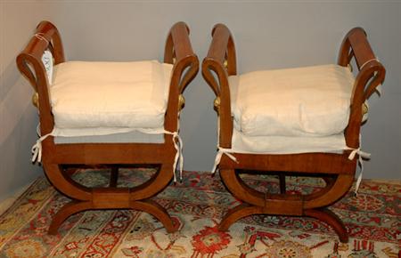 Lot image - Pair of Continental Neoclassical Parcel Gilt and Walnut Stools