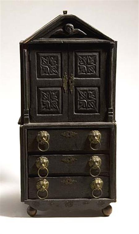 Lot image - Continental Carved and Black Painted Miniature Bookcase Cabinet