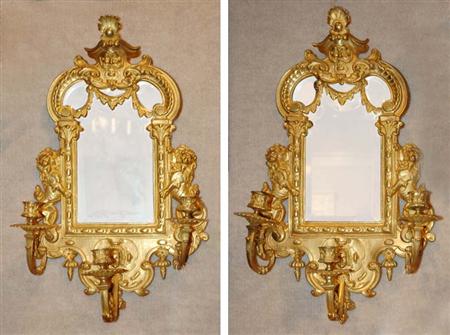 Lot image - Pair of Louis XIV Style Gilt-Metal Mirrored Three-Light Sconces