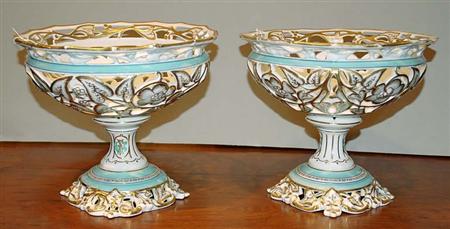 Lot image - Pair of Sevres Style Gilt Decorated Reticulated Porcelain Footed Compotes