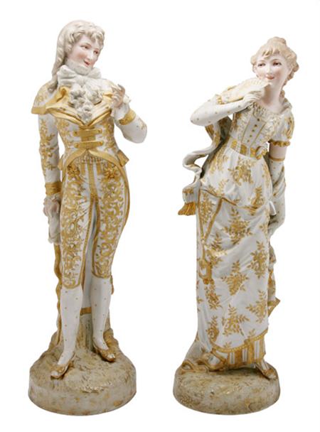 Lot image - Pair of Royal Dux Style Gilt Decorated Porcelain Figures