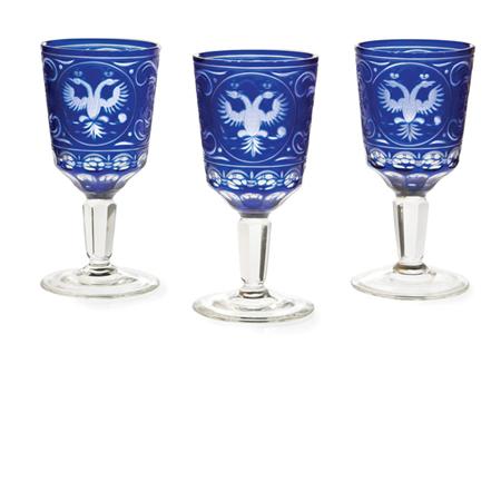 Lot image - Set of Thirteen Russian Blue and Colorless Cased and Wheel Engraved Wine Glasses