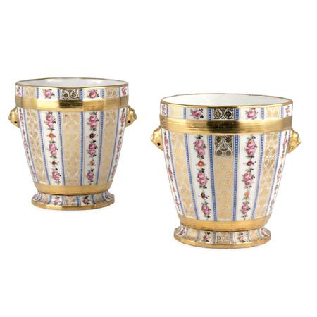 Lot image - Pair of Sevres Style Gilt and Floral Decorated Porcelain Cachepots