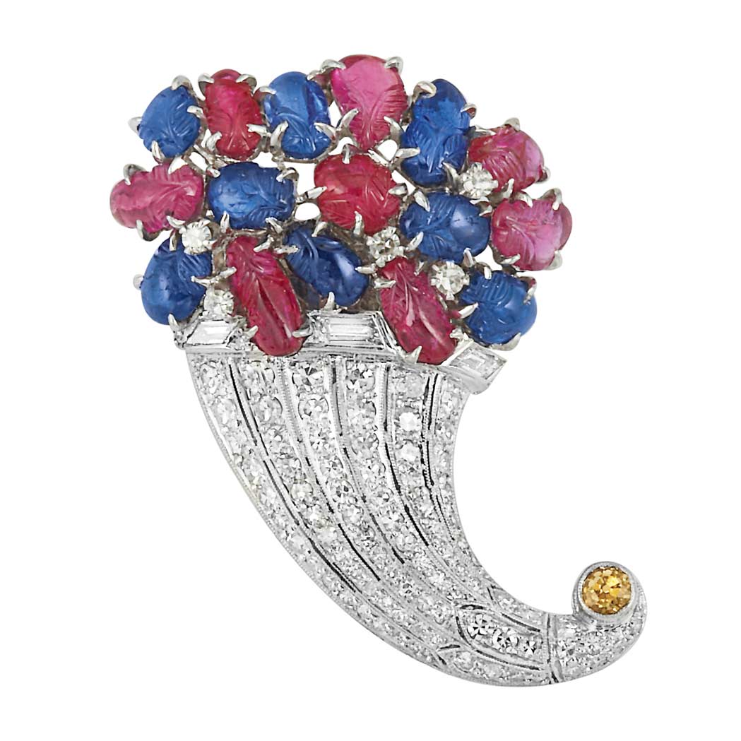 Lot image - Carved Ruby and Sapphire, Diamond and Yellow Diamond Cornucopia Clip-Brooch