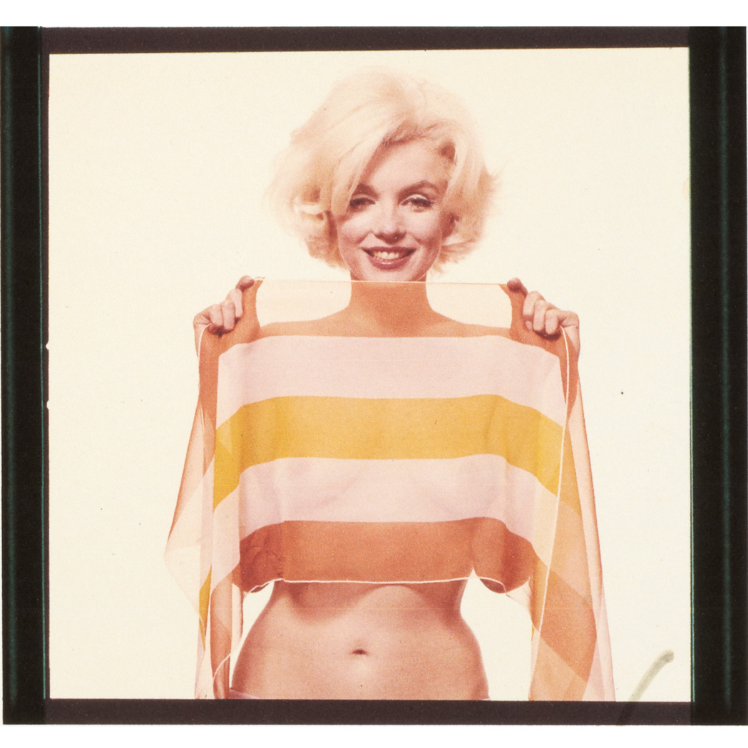 Lot image - STERN, BERT (1929-2013)  Marilyn Monroe with yellow scarf