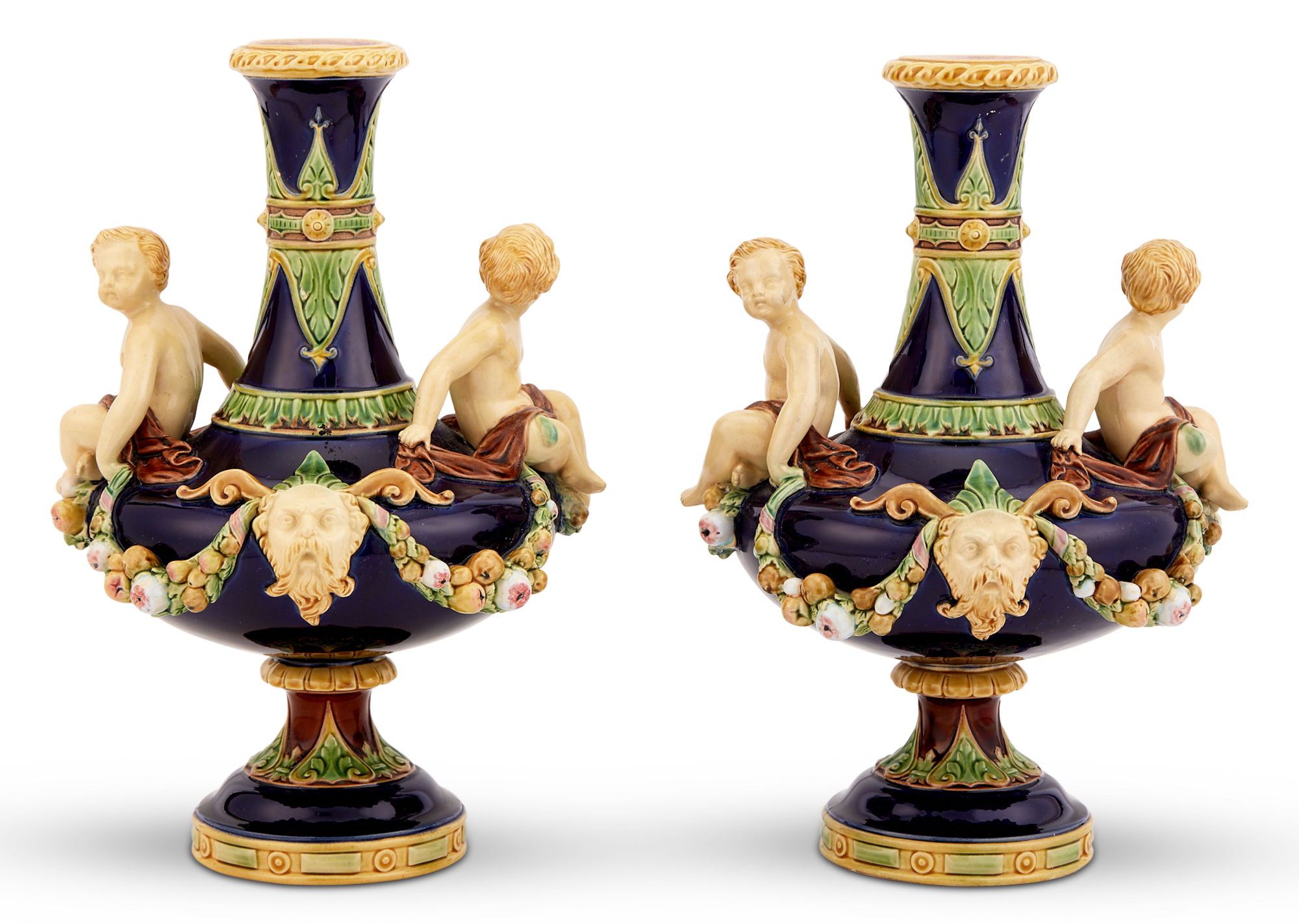 Lot image - Pair of Minton & Co. Majolica Cobalt-Ground Bottle-Form Vases With Twin Putto Handles