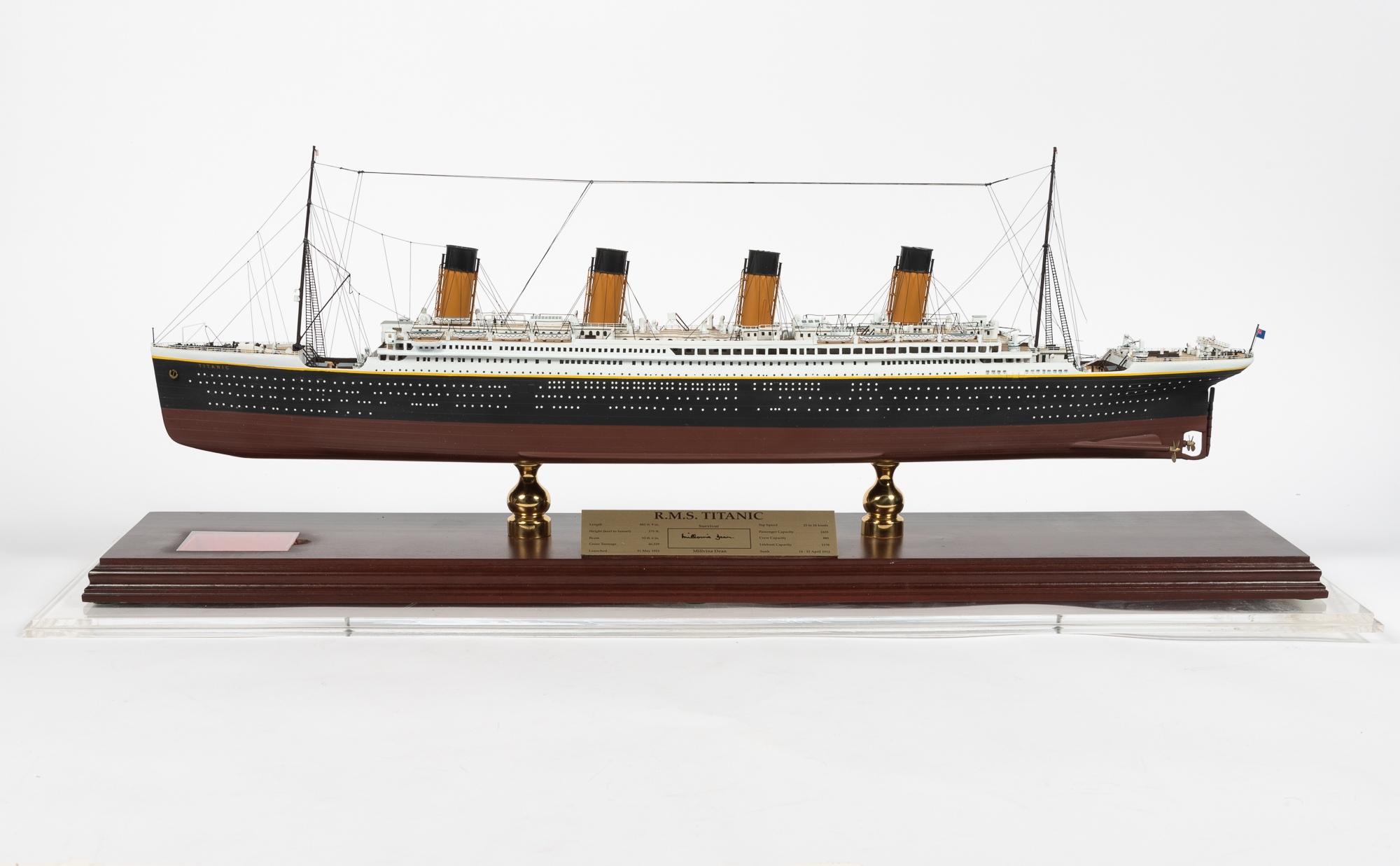 Lot image - [RMS TITANIC]  Model of the Titanic, approximately 1/350 scale, with a plaque signed by the last living survivor Millvina Dean, and a small piece of coal recovered during the 1994 Titanic Research and Recovery Expedition.