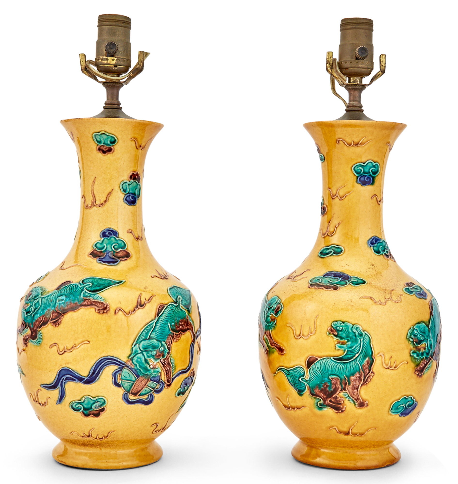 Lot image - Pair of Chinese Porcelain Lamps Molded with Foo Lions