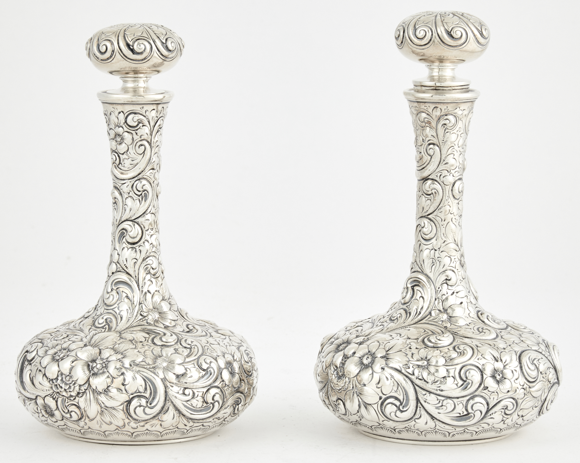 Lot image - Pair of J.E. Caldwell & Co. Sterling Silver Floral Decorated Bottles