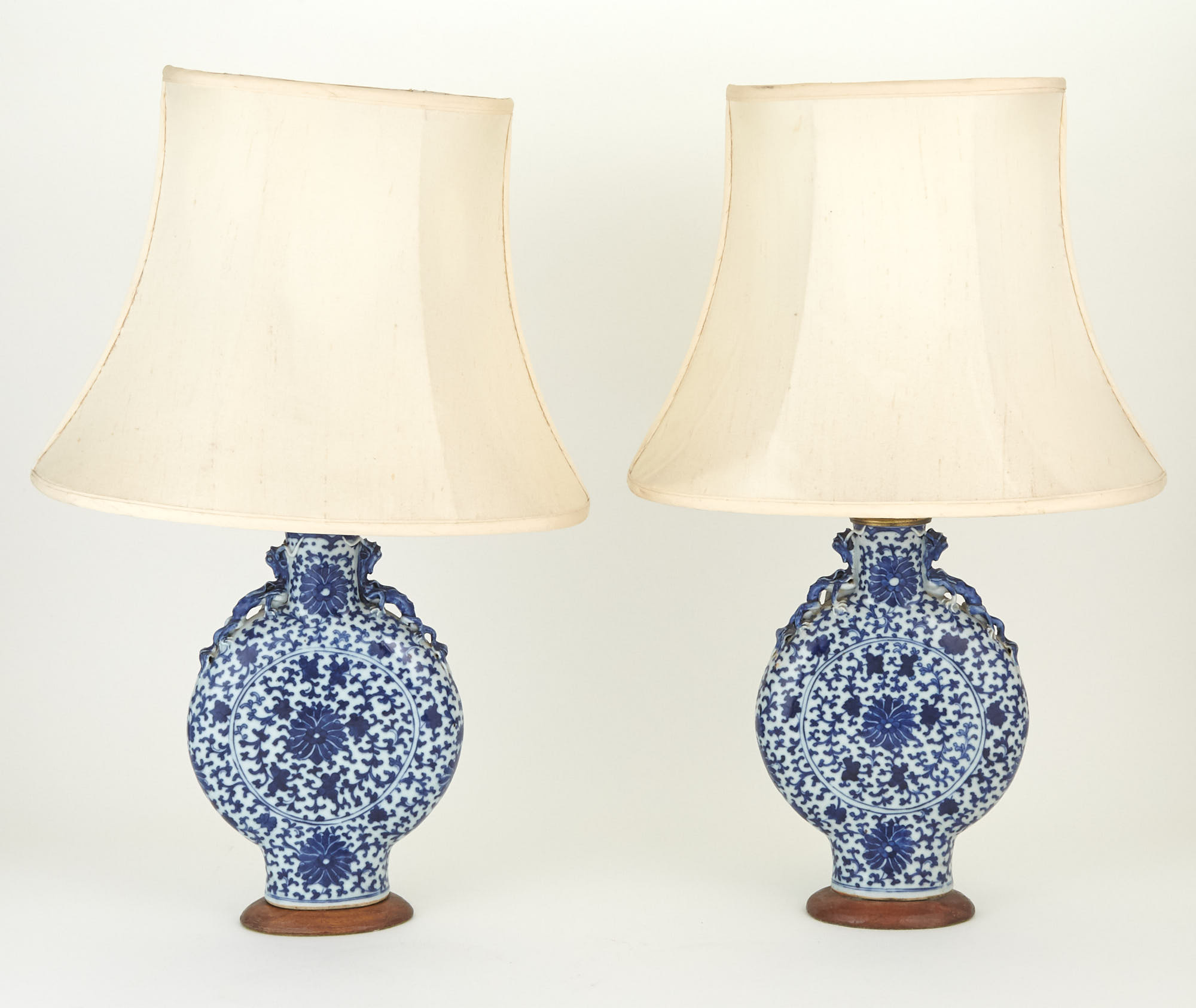 Lot image - Pair of Blue and White Porcelain Moon Vases Mounted as Lamps