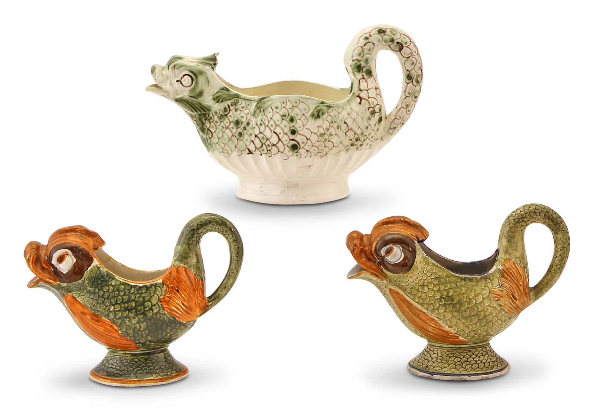 Lot image - Group of Three English Pearlware and Creamware Dolphin-Form Sauceboats