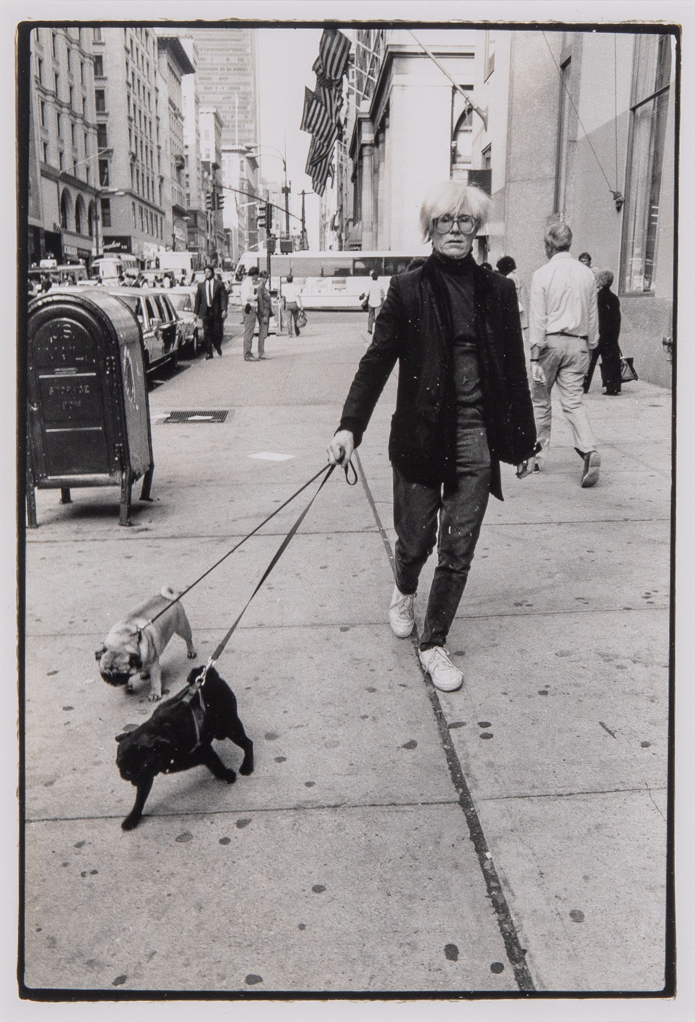 Lot image - ARI MARCOPOULOS  Andy Warhol with Pugs, 1986.