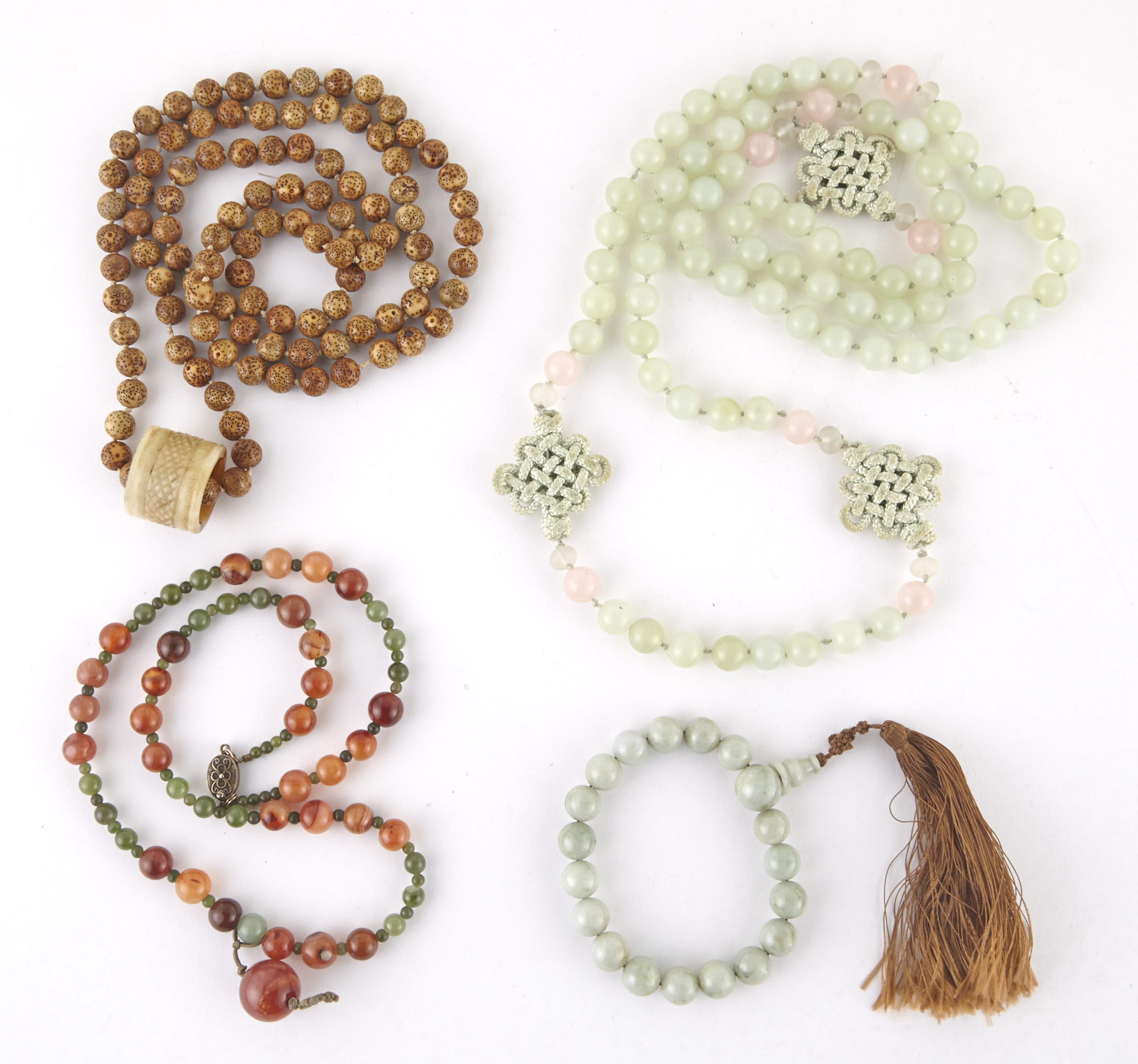 Lot image - Four Chinese Hardstone Buddhistic Beaded Strands