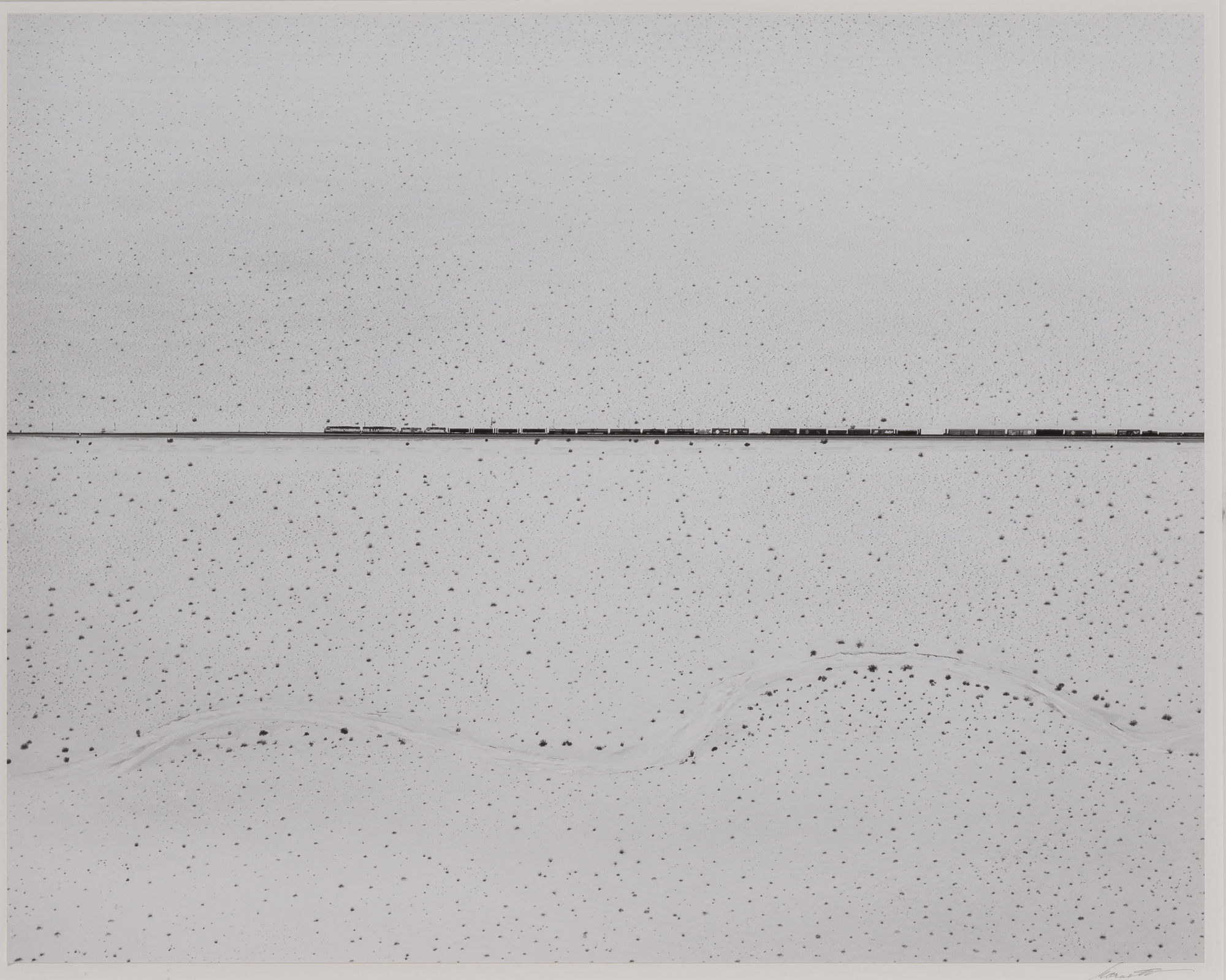 Lot image - GARNETT, WILLIAM A. (1916-2006)  Train Crossing the Desert Near Kelso