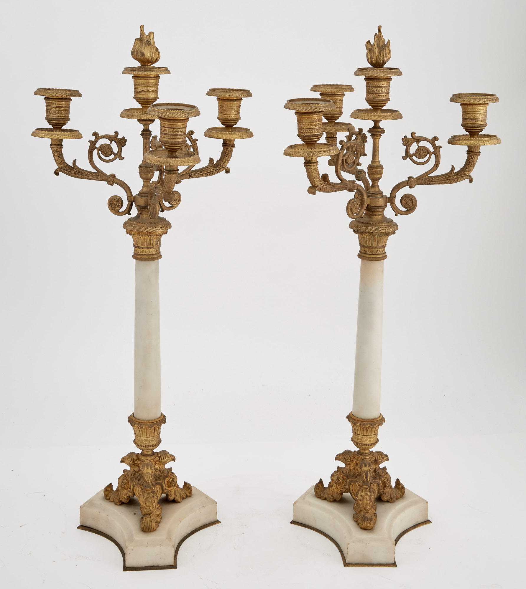 Lot image - Pair of Empire Style Gilt-Bronze and White Marble Three-Light Convertible Candelabra with Flame Finials