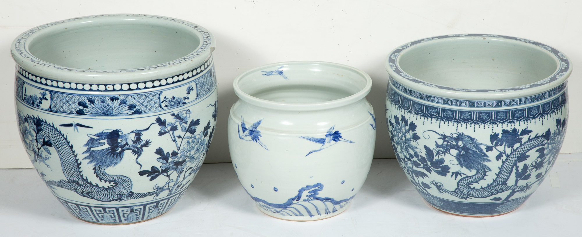 Lot image - Two Chinese Blue and White Jardinières; Together with a Japanese Porcelain Jardinière
