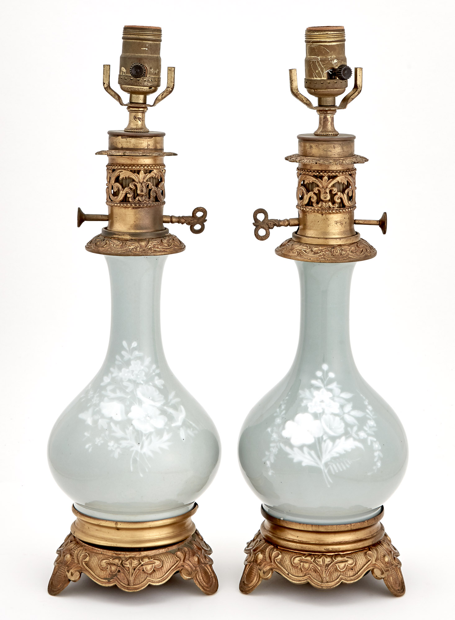 Lot image - Pair of French Gilt-Metal Mounted Pâte-Sur-Pâte Sage Green Ground Porcelain Bottle-Form Lamps