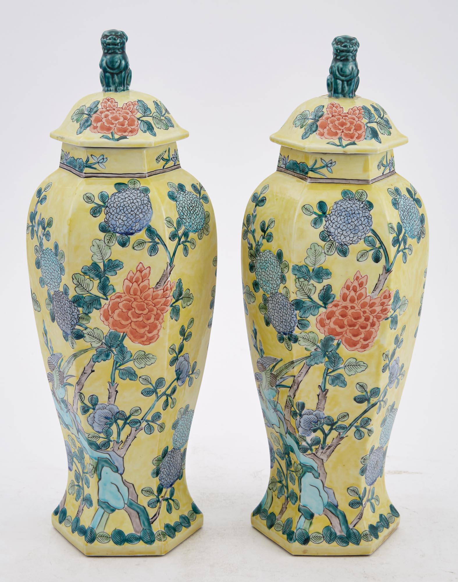 Lot image - Pair of Chinese Floral Decorated Yellow Ground Porcelain Urns with Covers with Foo Dog Finials