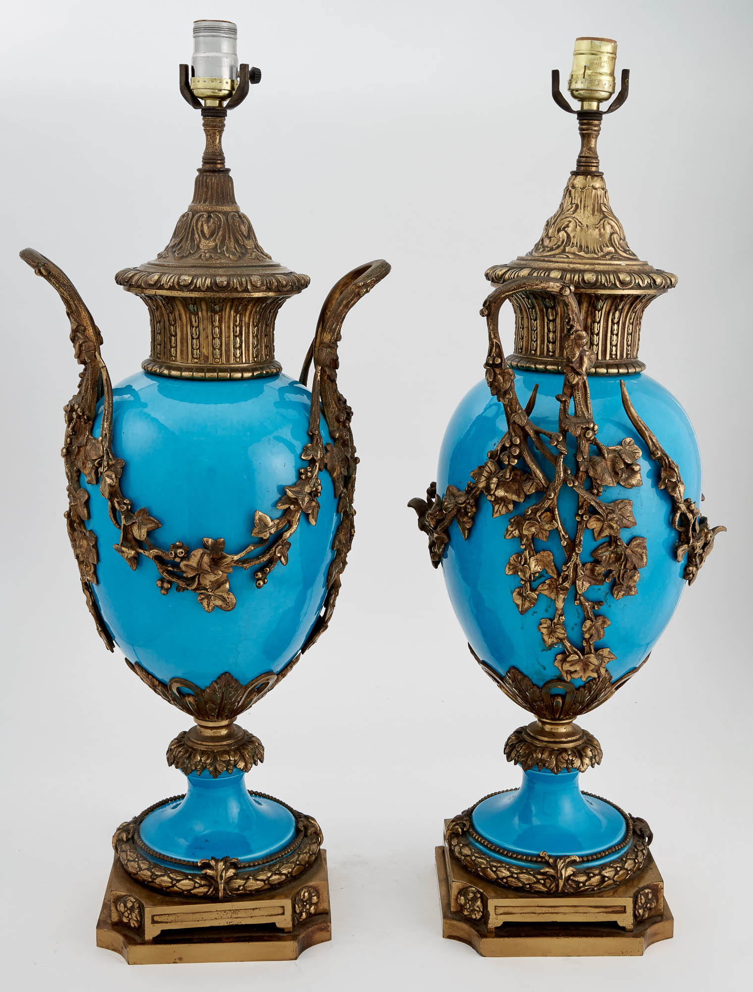 Lot image - Pair of Sèvres Style Gilt-Metal Mounted Turquoise Glazed Porcelain Urn-Form Two-Handled Lamps