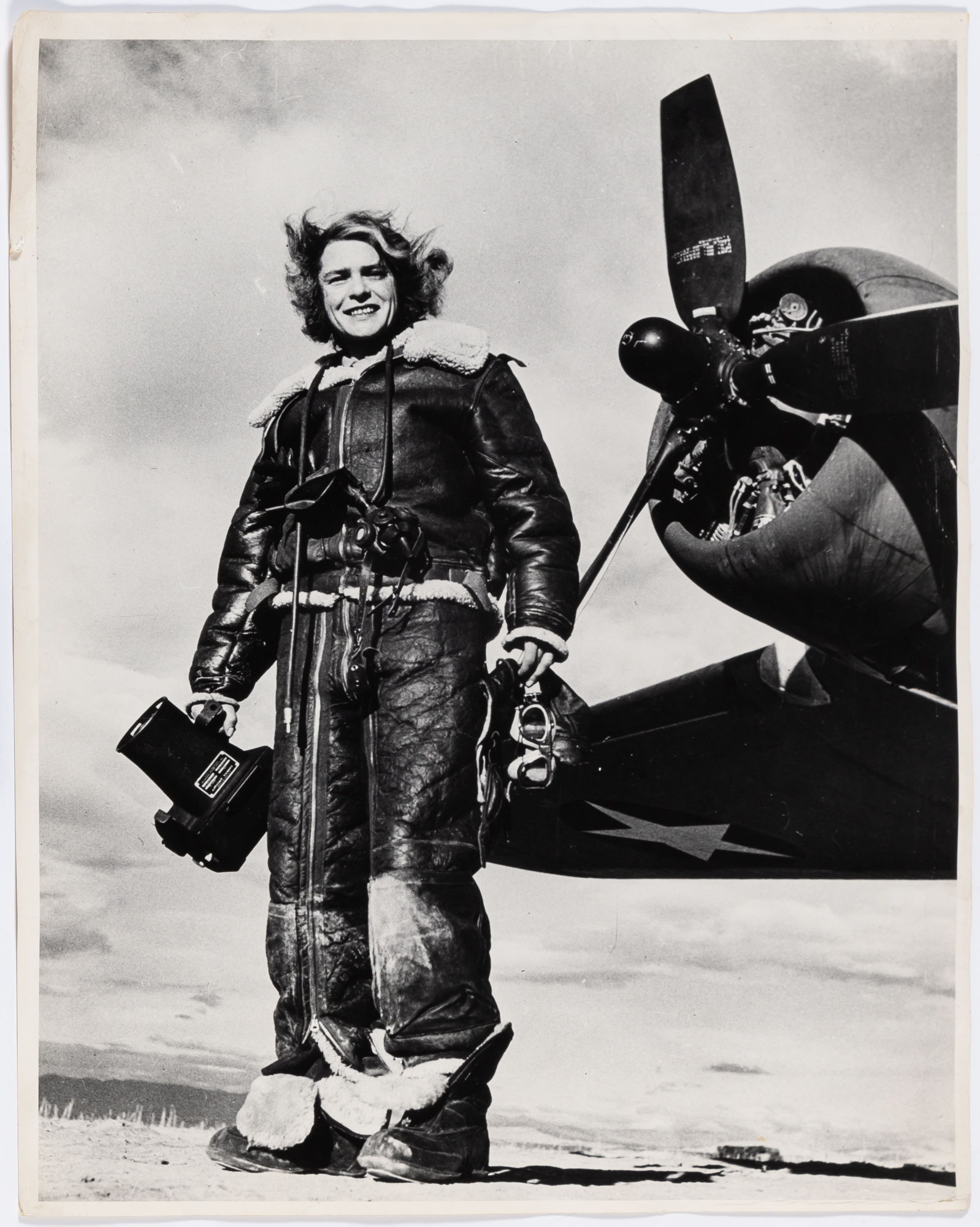 Lot image - BOURKE-WHITE, MARGARET (1904-1971)  [Self-Portrait in Aviators Suit],