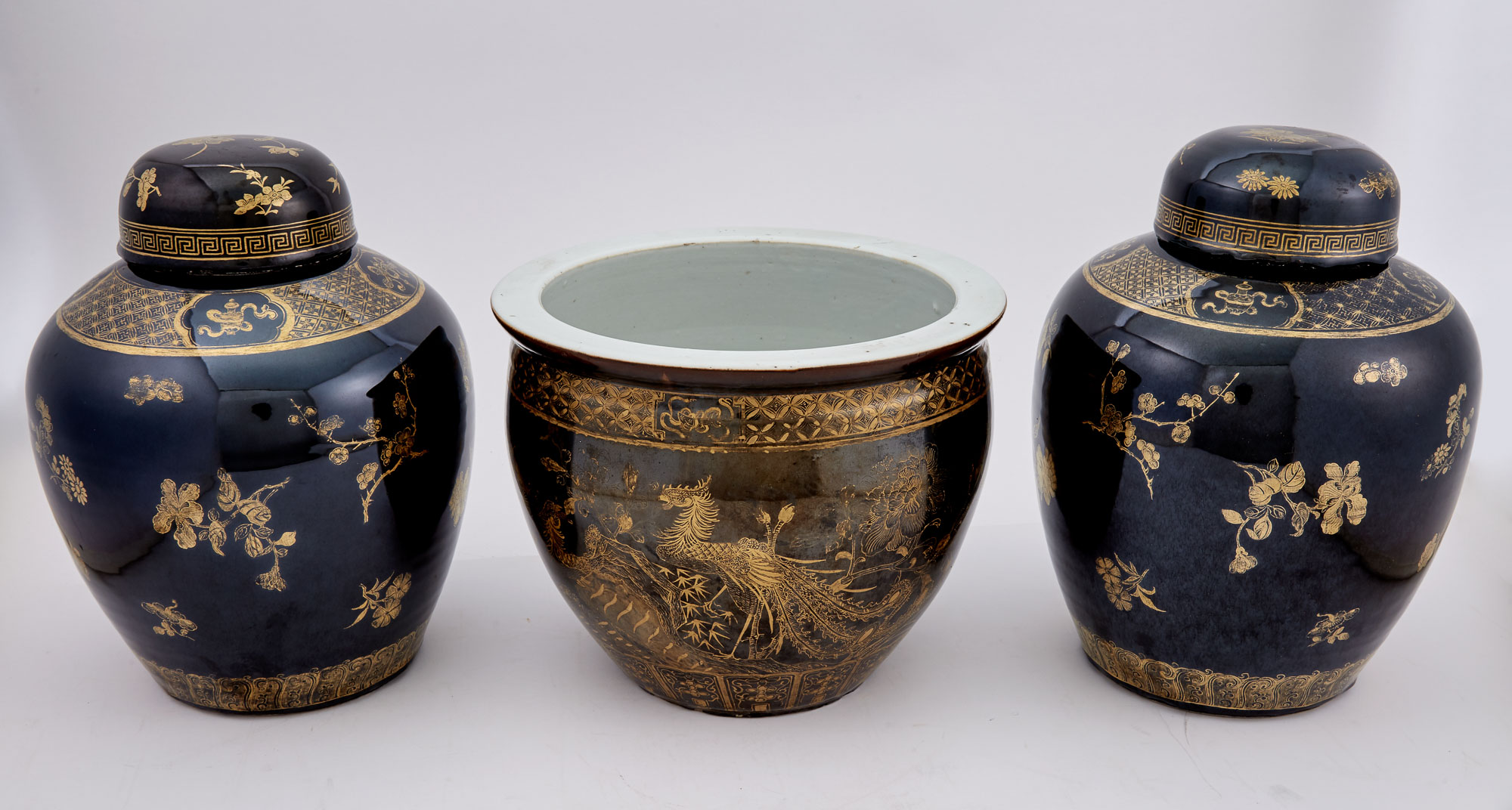 Lot image - Pair of Chinese Gilt-Decorated Mirror Black Ground Porcelain Jars and Covers