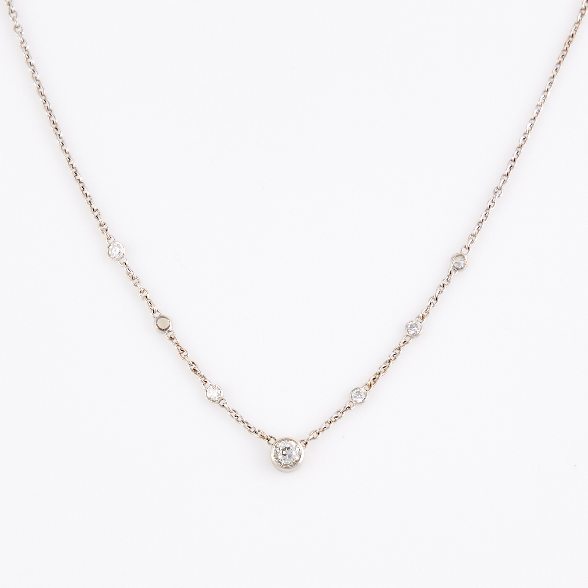 Lot image - Diamond Necklace, 6 diamonds, center stone about 0.75 ct., 5 stones about 0.50 ct., 18K 5 dwt.,     stone missing