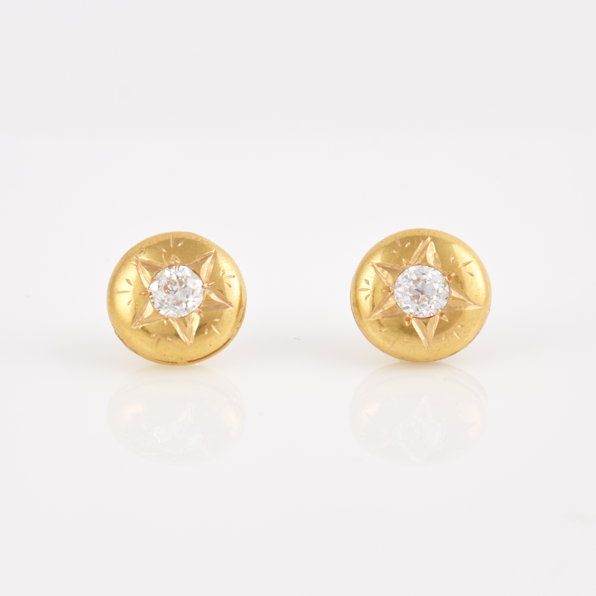 Lot image - Two Diamond Solitaire Earrings about 0.80 ct., 18K 1 dwt., stone damaged