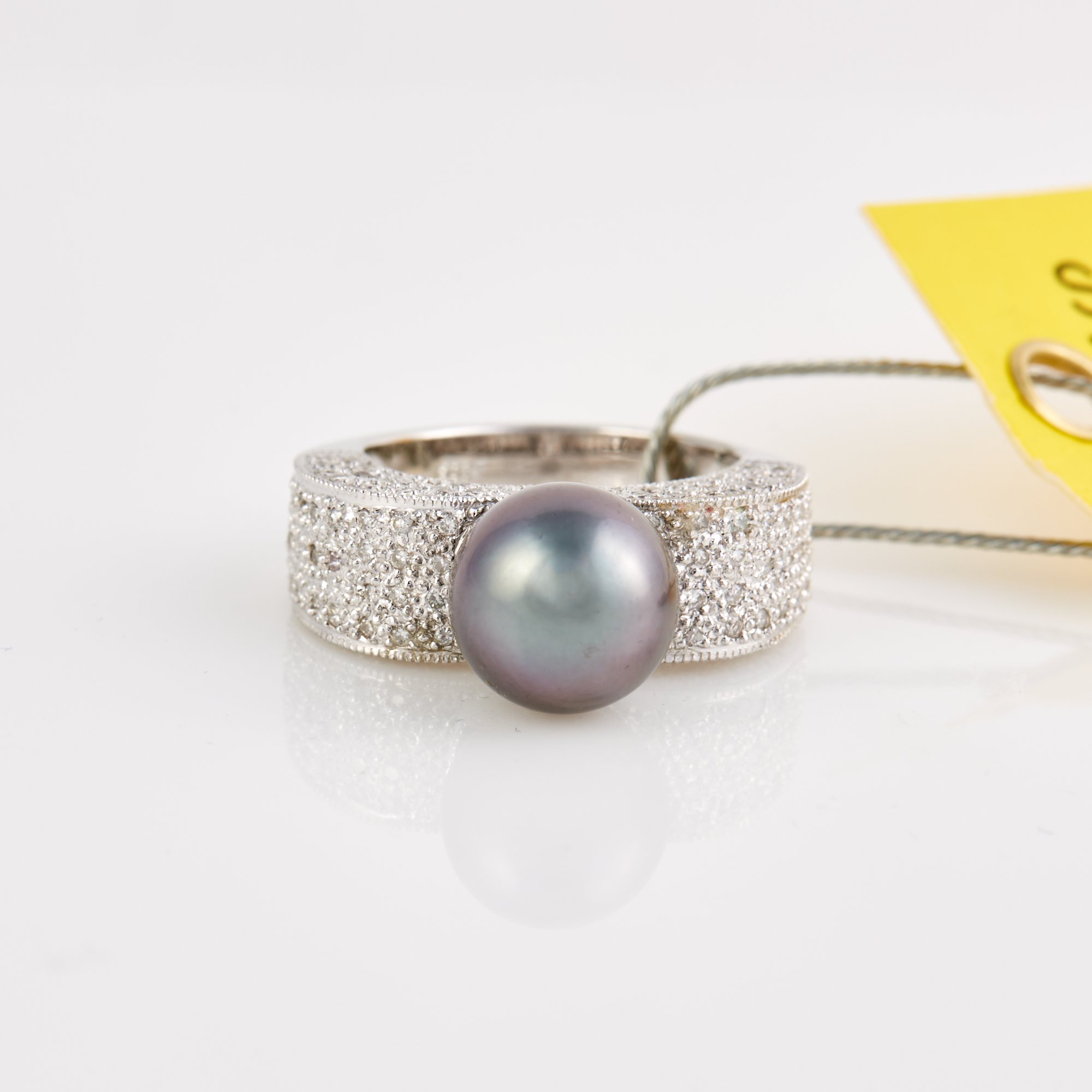 Lot image - Diamond and Bead Ring, 146 diamonds about 0.70 ct., 14K 5 dwt. all