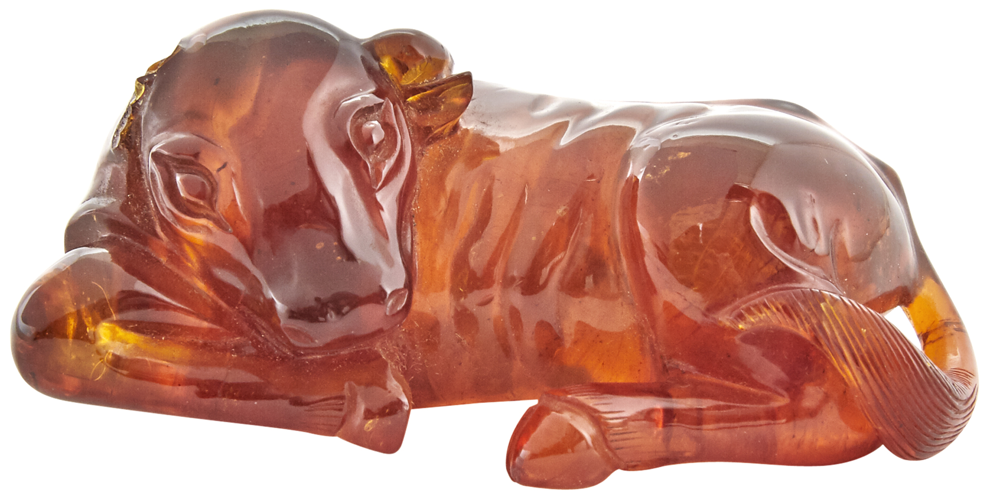 Lot image - A Small Chinese Amber Carving of a Recumbent Buffalo