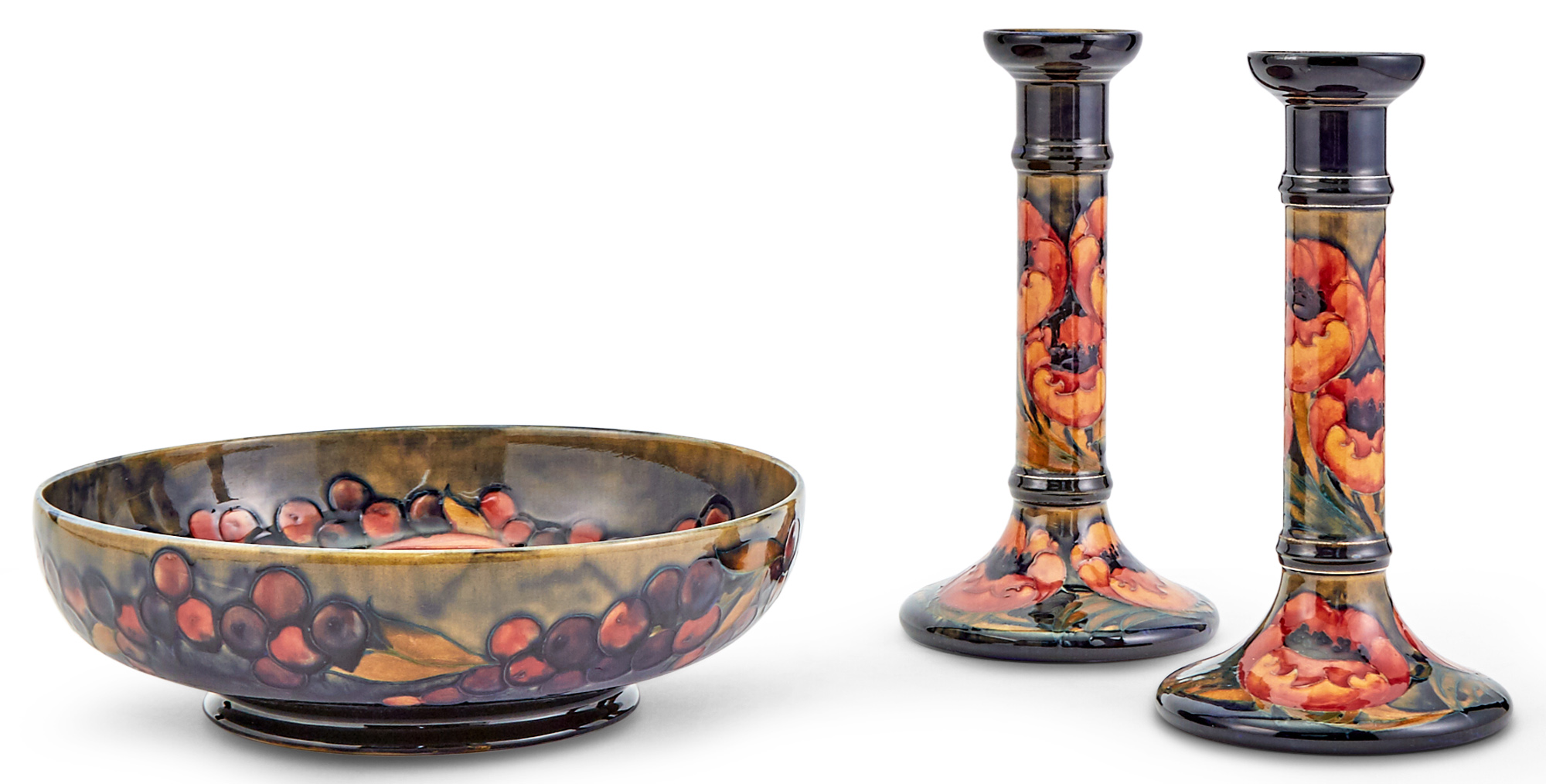 Lot image - Pair of Moorcroft Candlesticks and Centerpiece Bowl
