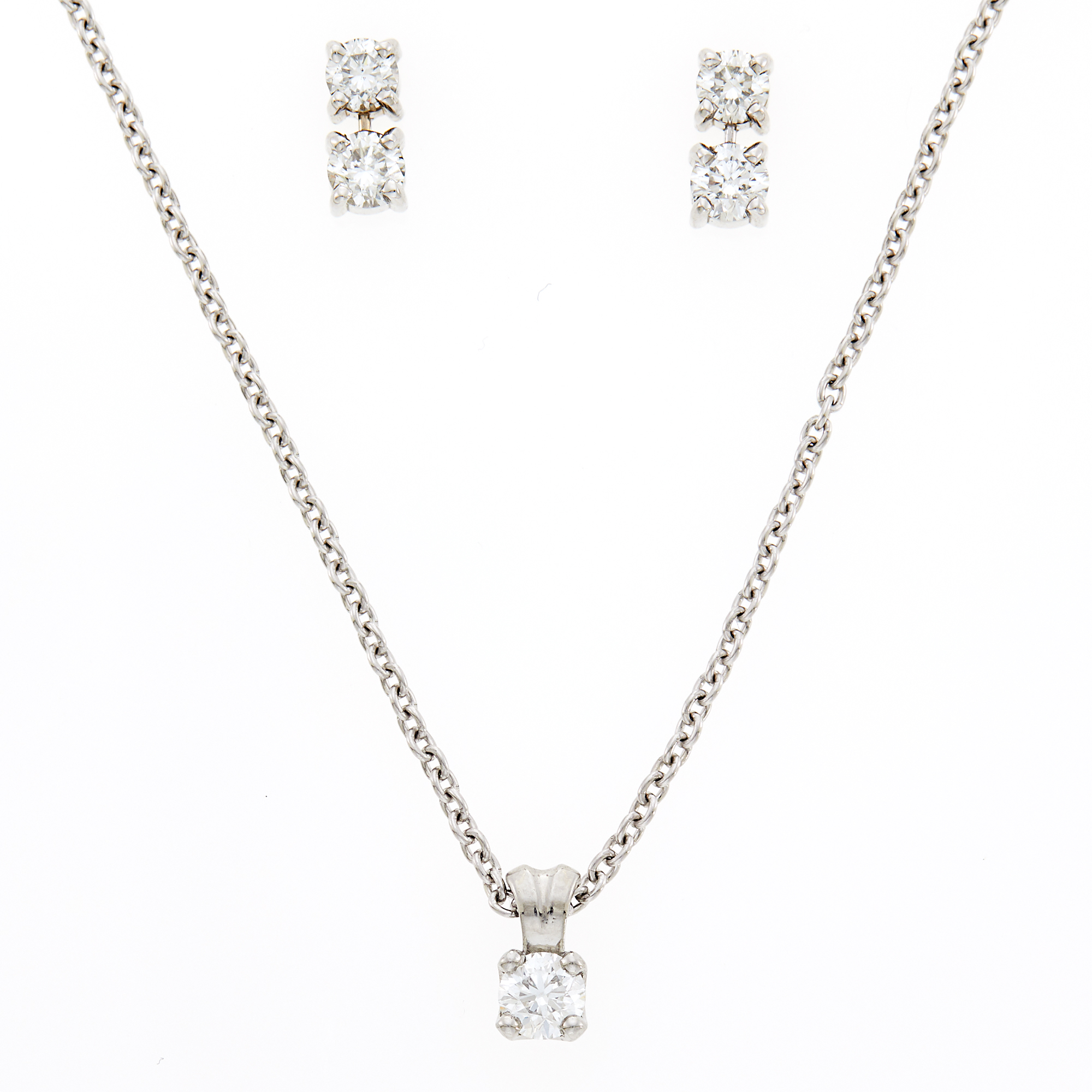 Lot image - Platinum and Diamond Pendant with Chain Necklace and Pair of White Gold and Diamond Earrings