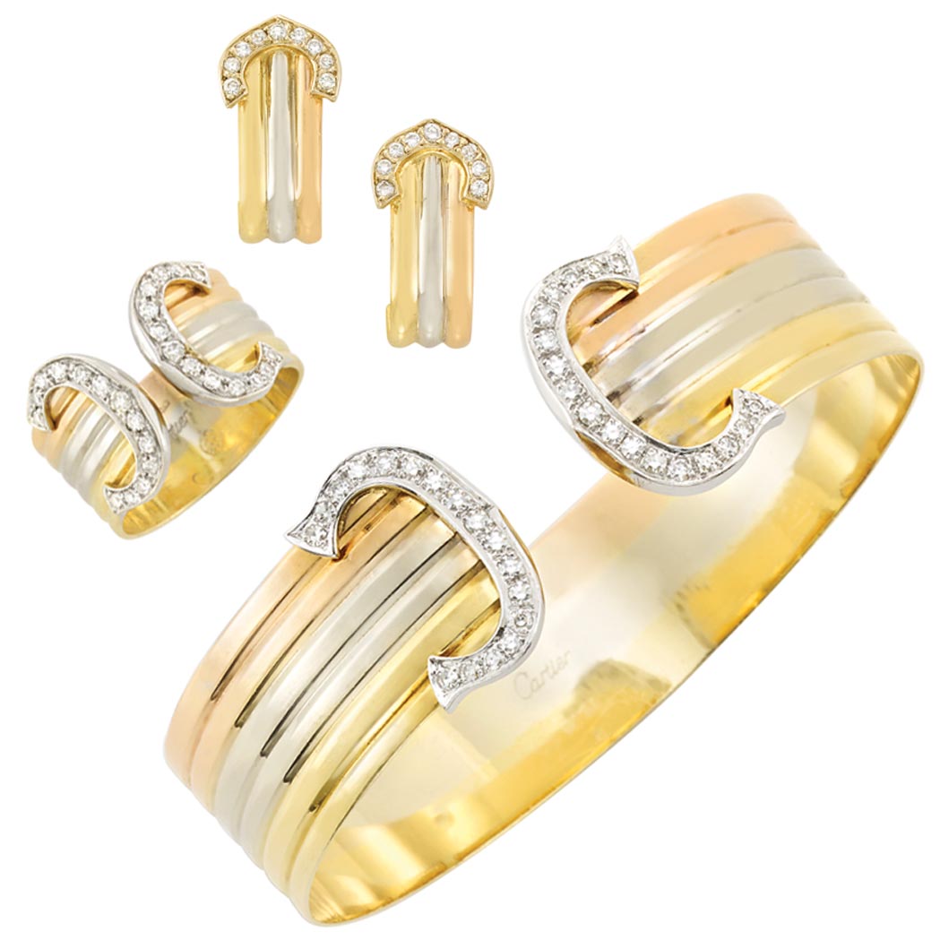 Lot image - Tricolor Gold and Diamond 'Double C' Cuff Bangle Bracelet and Ring, Cartier, and Pair of Earrings