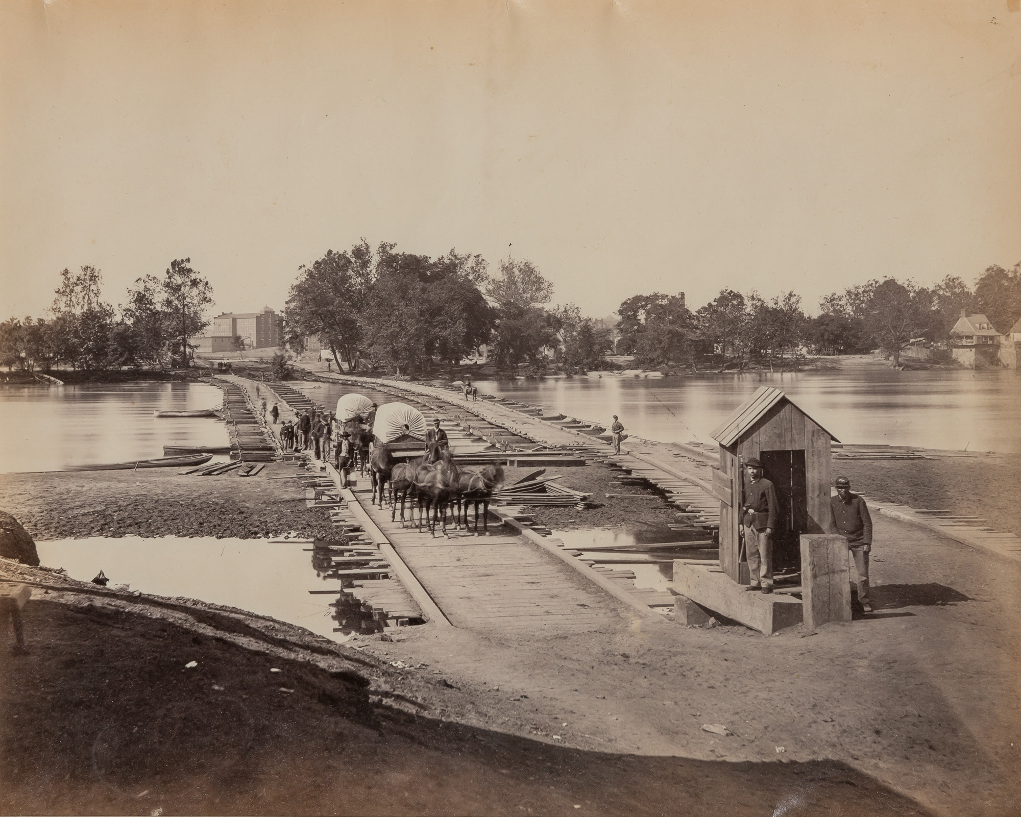 Lot image - RUSSELL, ANDREW JOSEPH [attrib.] (1830-1902)  Wagons Crossing Over Bridge with Troops,