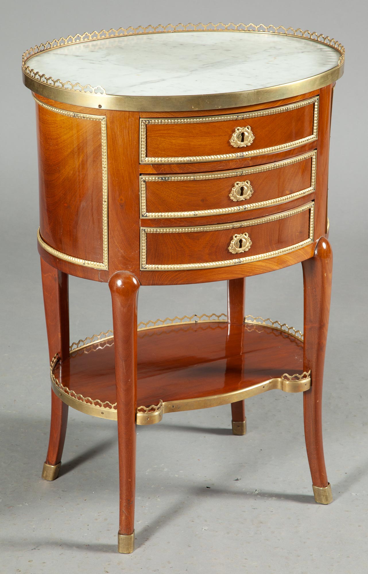 Lot image - Louis XV/XVI Transitional Style Gilt-Metal-Mounted Mahogany Table en Chiffonier