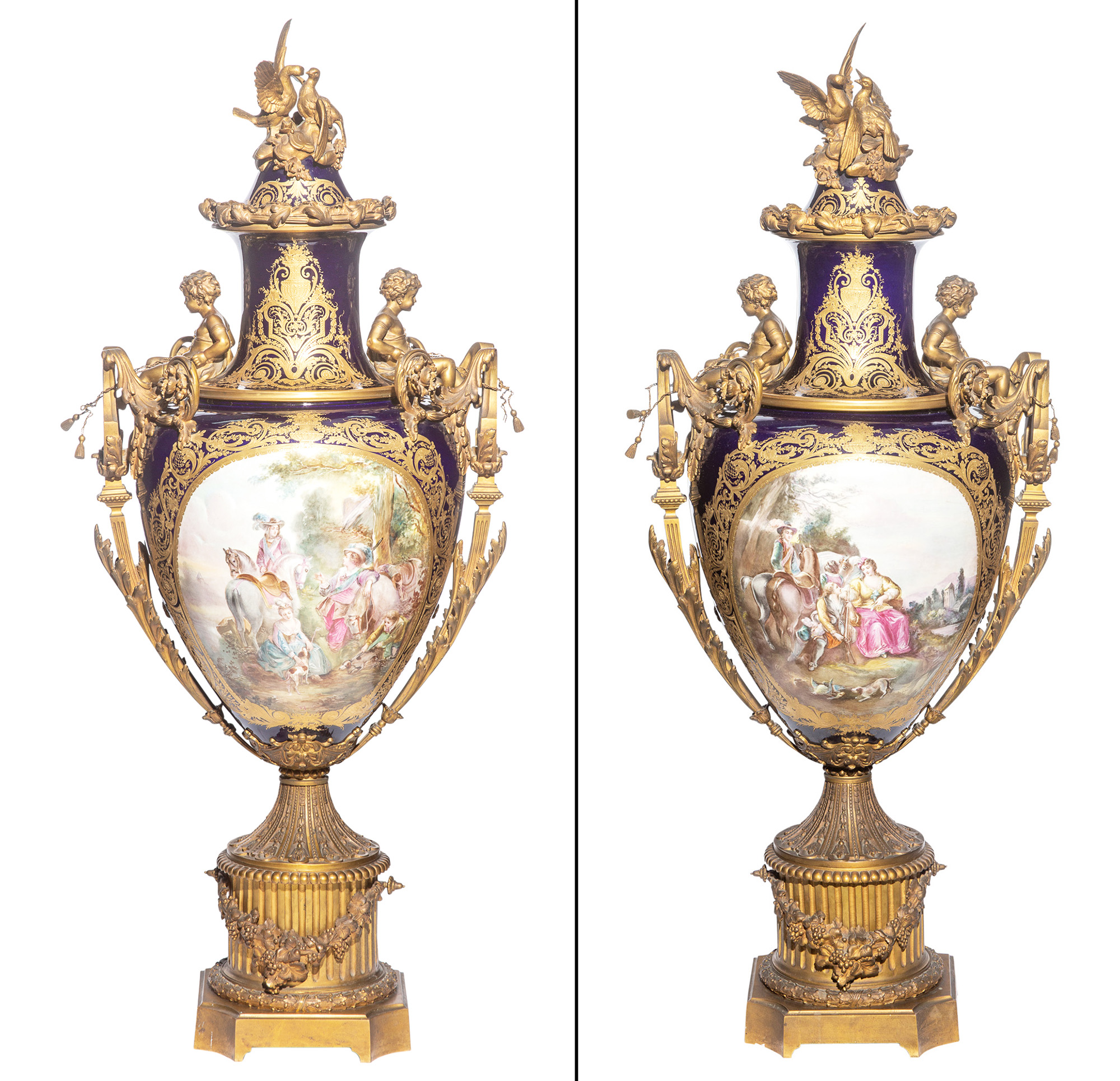 Lot image - Pair of Sèvres Style Gilt-Metal Mounted Cobalt-Ground Porcelain Covered Urns