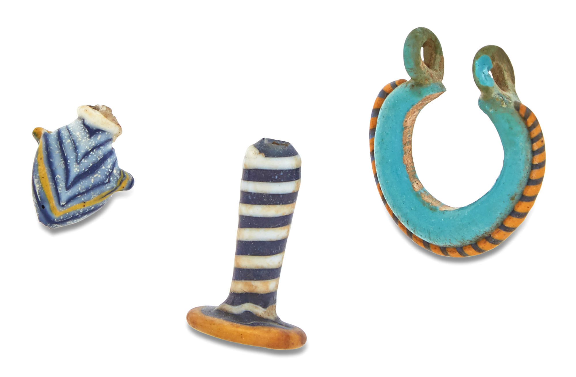 Lot image - Egyptian Glass Earring, Ear Flare and Heart Amulet