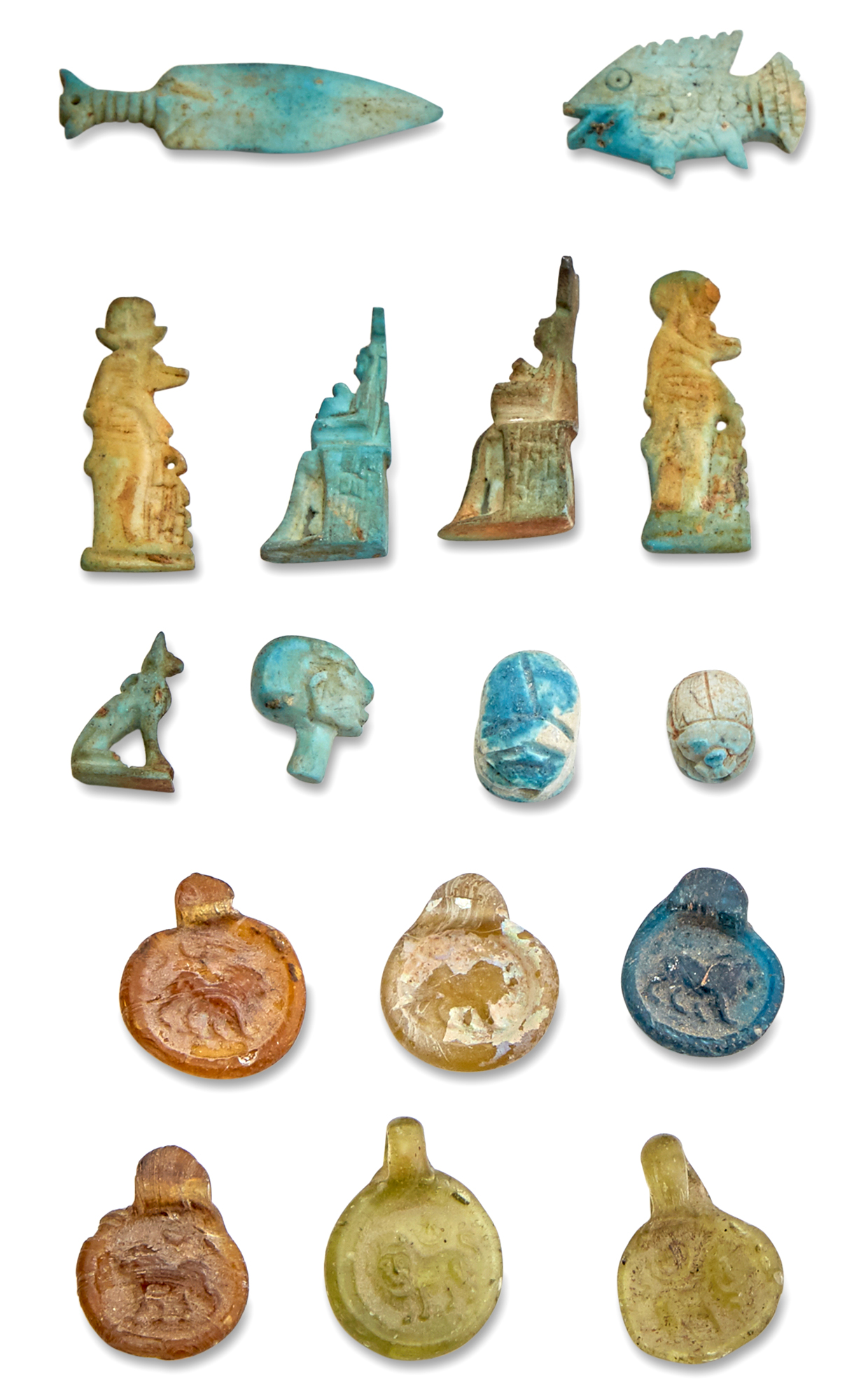 Lot image - Group of Egyptian Faience Amulets, Scarabs and Late Roman Glass Pendants