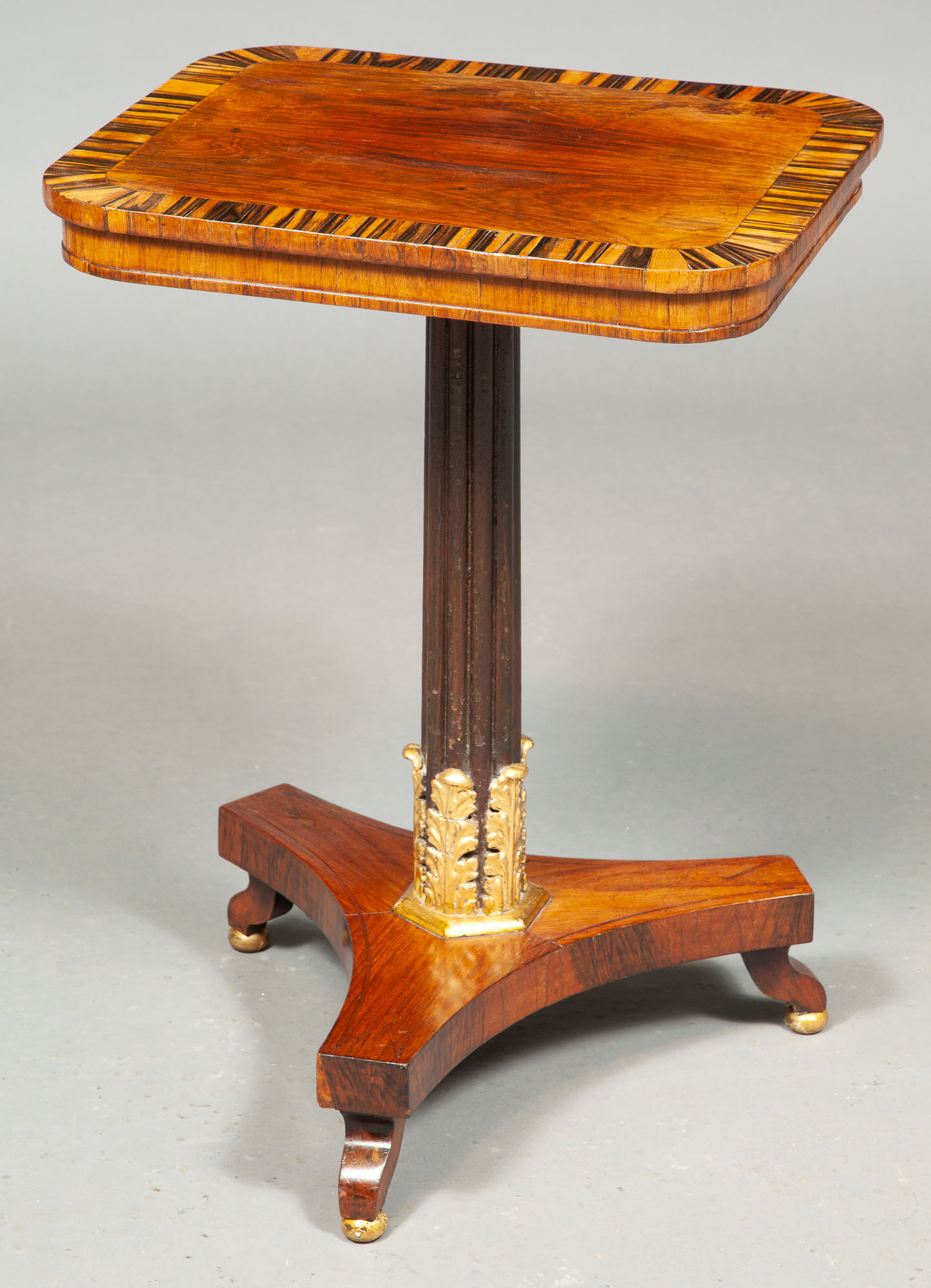 Lot image - Regency Rosewood, Calamander, Faux Rosewood and Parcel-Gilt Occasional Table